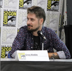 Profile picture of Greg Hinkle sitting at a Panel Table for San Diego Comicon